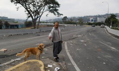 Photo of a man walking his dog in Venezuela