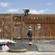 Photo of construction site and workers