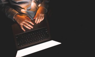 Photo of woman's hands at a laptop