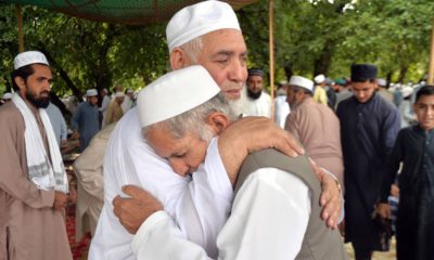 Photo of Pakistani Muslims greeting each other