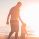 Photo of father and sun on the beach