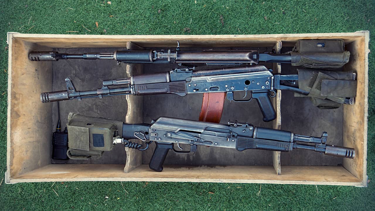 photo of three machine guns in a box