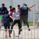 Photo of immigrant children playing soccer