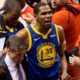 Photo of Kevin Durant reacting as he leaves the court after sustaining injury during Game 5