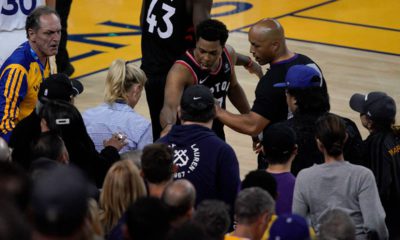 Photo of Kyle Lowry gesturing next to referee Marc Davis at Game 3 of the NBA Finals in Oakland, CA.