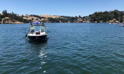 Photo of search boat looking for pilot and plane that sank at Lake Tulloch