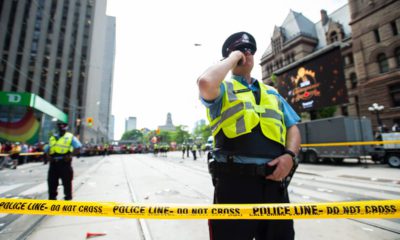 Photo of Toronto police securing the scene after shots were fired during the Raptors parade