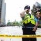 Photo of Toronto police securing the scene after shots were fired during the Raptors parade