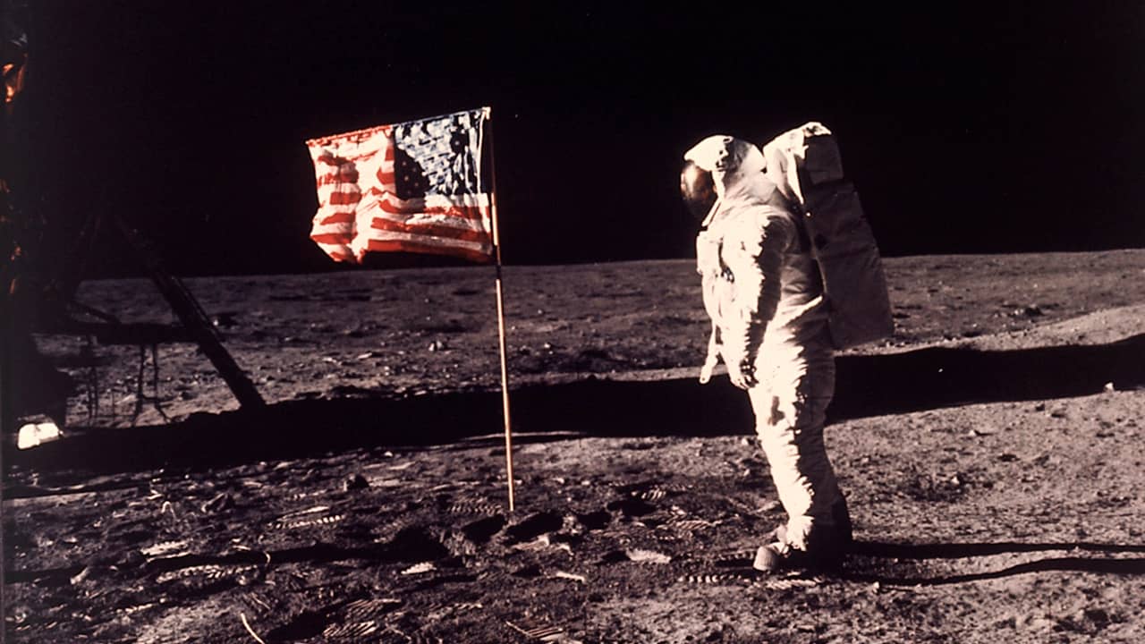 Photo of astronaut Buzz Aldrin posing for a photo beside the US flag on the moon