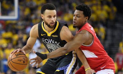 Photo of Golden State Warriors guard Stephen Curry and Toronto Raptors guard Kyle Lowry
