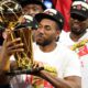 Photo of Kawhi Leonard holding the Larry O'Brien NBA Championship Trophy