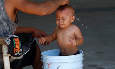 Photo of a baby getting a bath at a migrant shelter in Mexico