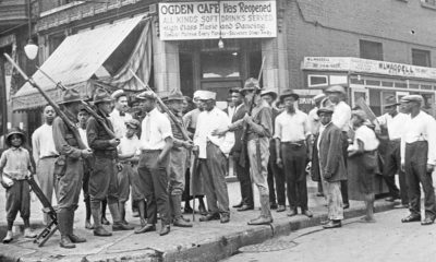 Photo of a crowd of men and armed National Guard