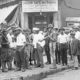 Photo of a crowd of men and armed National Guard