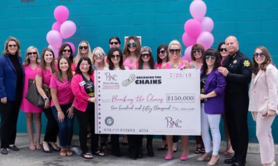 Photo of PINC donating $150,000 to Breaking the Chains