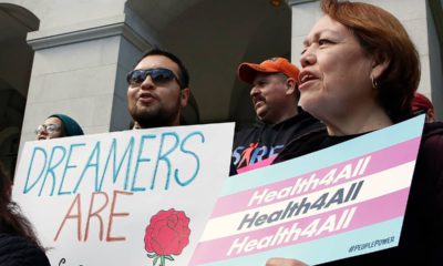 Photo of supporters of proposals to expand health coverage to immigrants in the country illegally