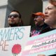 Photo of supporters of proposals to expand health coverage to immigrants in the country illegally