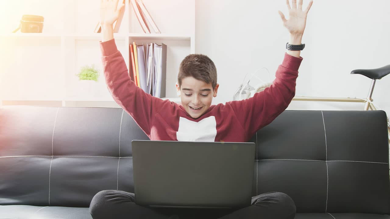 Shutterstock photo of a young male student celebrating his admission to a magnet schooltu