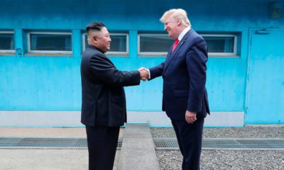 Photo of Kim Jong Un shaking hands with Donald Trump