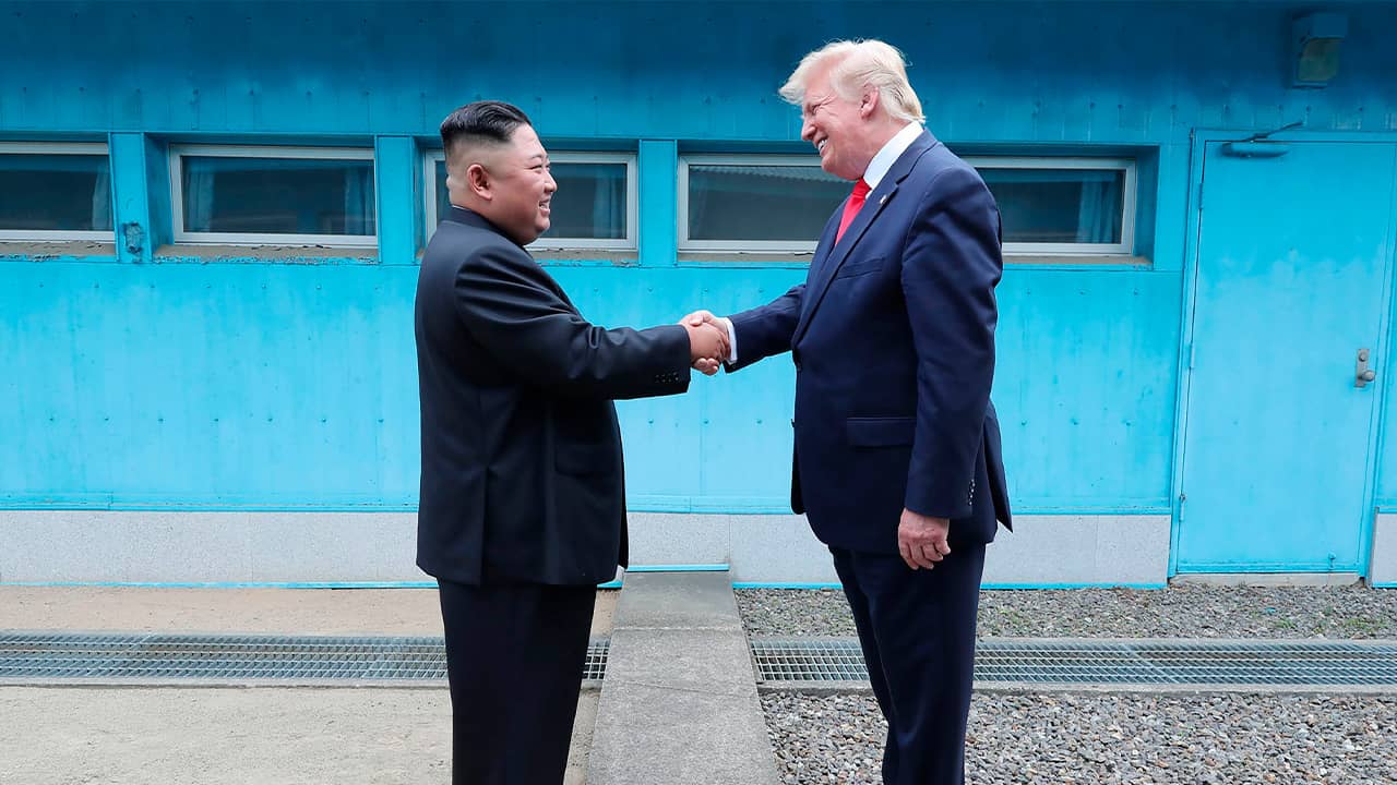 Photo of Kim Jong Un shaking hands with Donald Trump