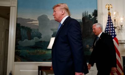Photo of President Donald Trump and Vice President Mike Pence walking through the White House