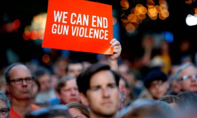 Photo of people attending a vigil for mass killing victims in Dayton, Ohioon