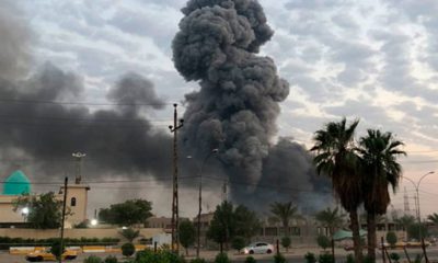 Photo of plumes of smoke rising at a military base in Baghdad, Iraq