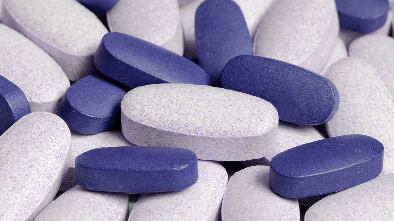 Photo of blue and white pills