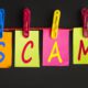 The letters s c a m hanging from a clotheslines signifying a scam