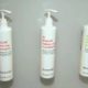 Photo of little shampoo, conditioner and shower gel bottles