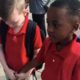 Photo of two kids holding hands