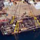 Photo of the Conception being brought out of the water by a salvage team