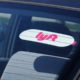 Photo of a Lyft sticker on a car window