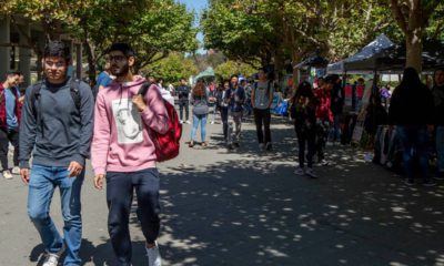 Photo of college students walking through campus