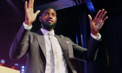 Photo of Paul George in a suit