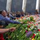 Photo of Armenians placing flowers at Armenian genocide memorial in Yerevan, Armenia