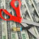 Composite image of money, scissors and cable TV cord
