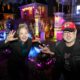 Photo of Beth LeFauve and Nelson Gonzalez posing in front of their decorated homes