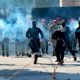 Photo of Iraqi security forces firing tear gas