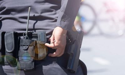 Photo of a police belt and gun