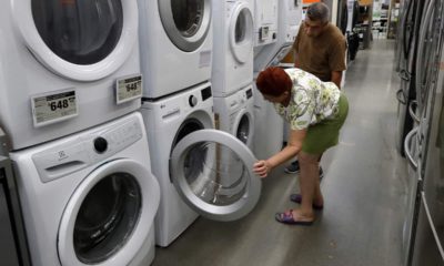 Photo of a woman examining washers