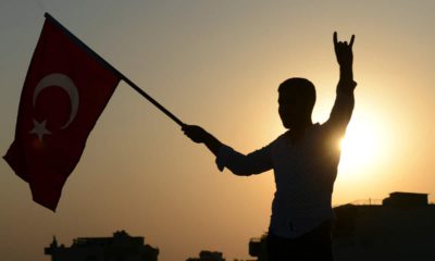 Photo of someone holding a Turkish flag