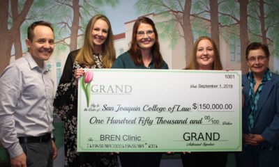 Photo of check presentation of $150,000 from GRAND to the SJCL for the BREN Clinic