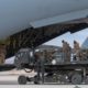 Photo of U.S. service members loading military equipment