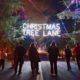 A photo of pedestrians enjoying "walk night" on Christmas Tree Lane