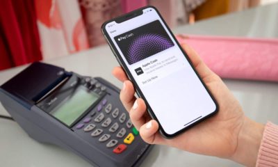 Photo of a woman paying with Apple Pay