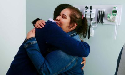 Photo of Dr. Moazzum Bajwa hugging his patient