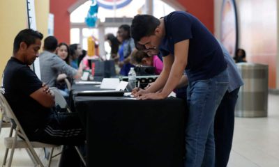 Photo of a man filling out a job application