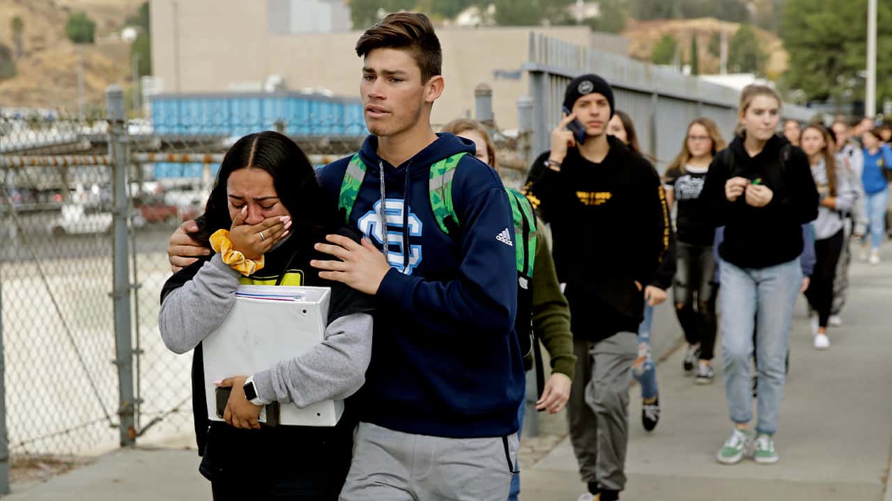 Photo of students being escorted out of Saugus High School