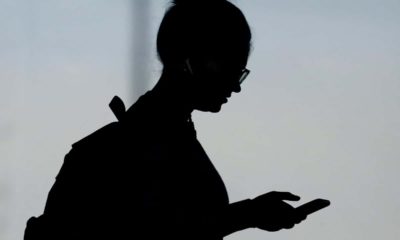 Photo of a woman checking her phone